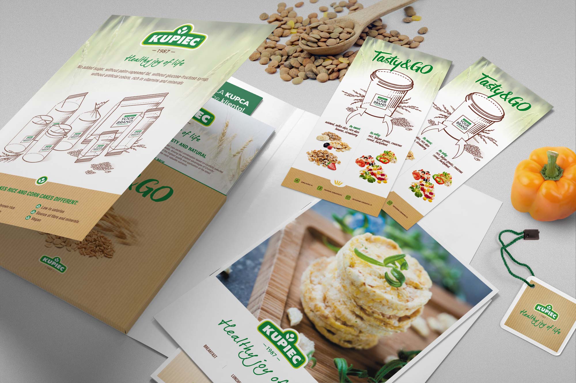 Kupiec – sales materials flat lay overview
